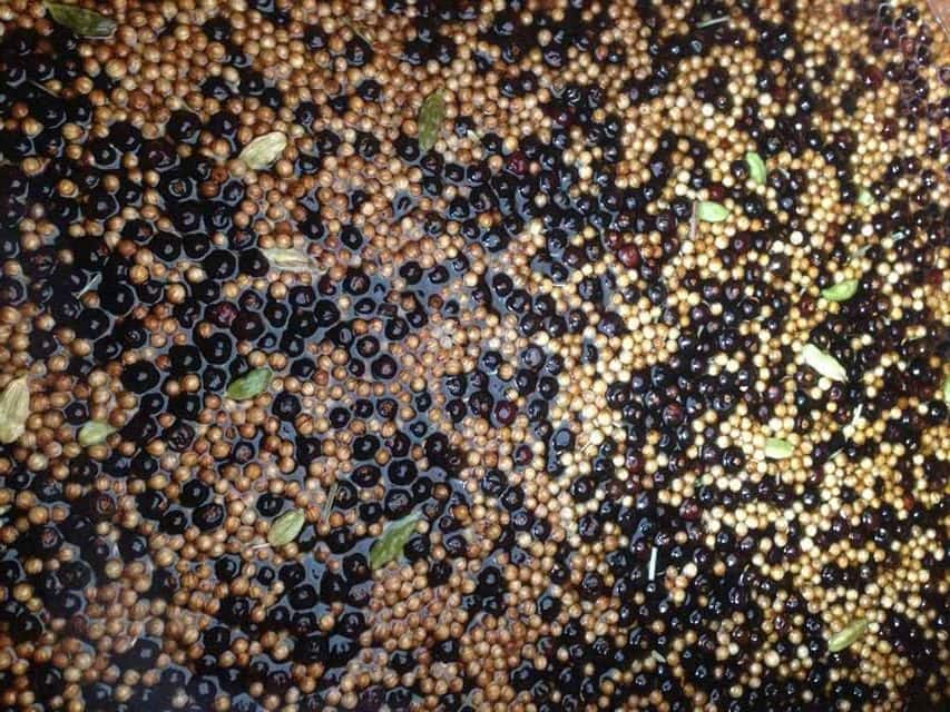 Juniper Berries and gin botanicals steeping in alcohol ready for distillation