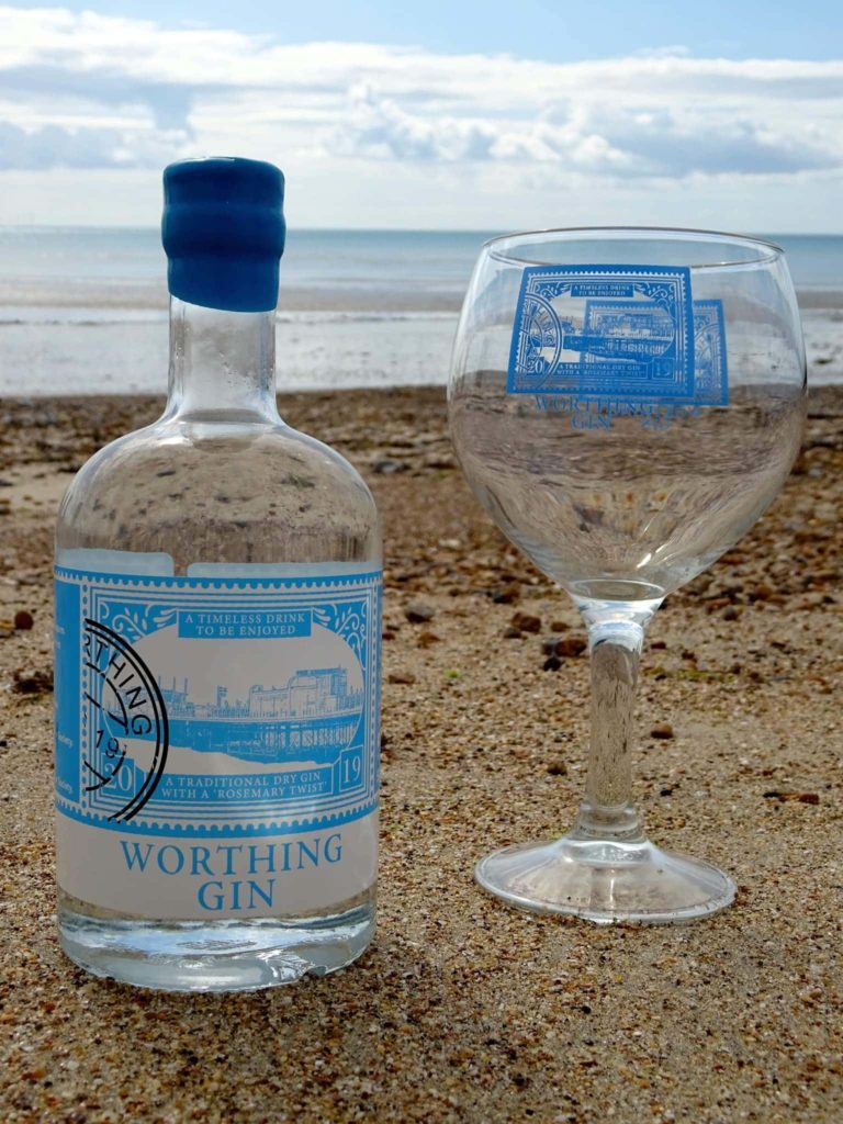 A bottle of Worthing Gin at the beach
