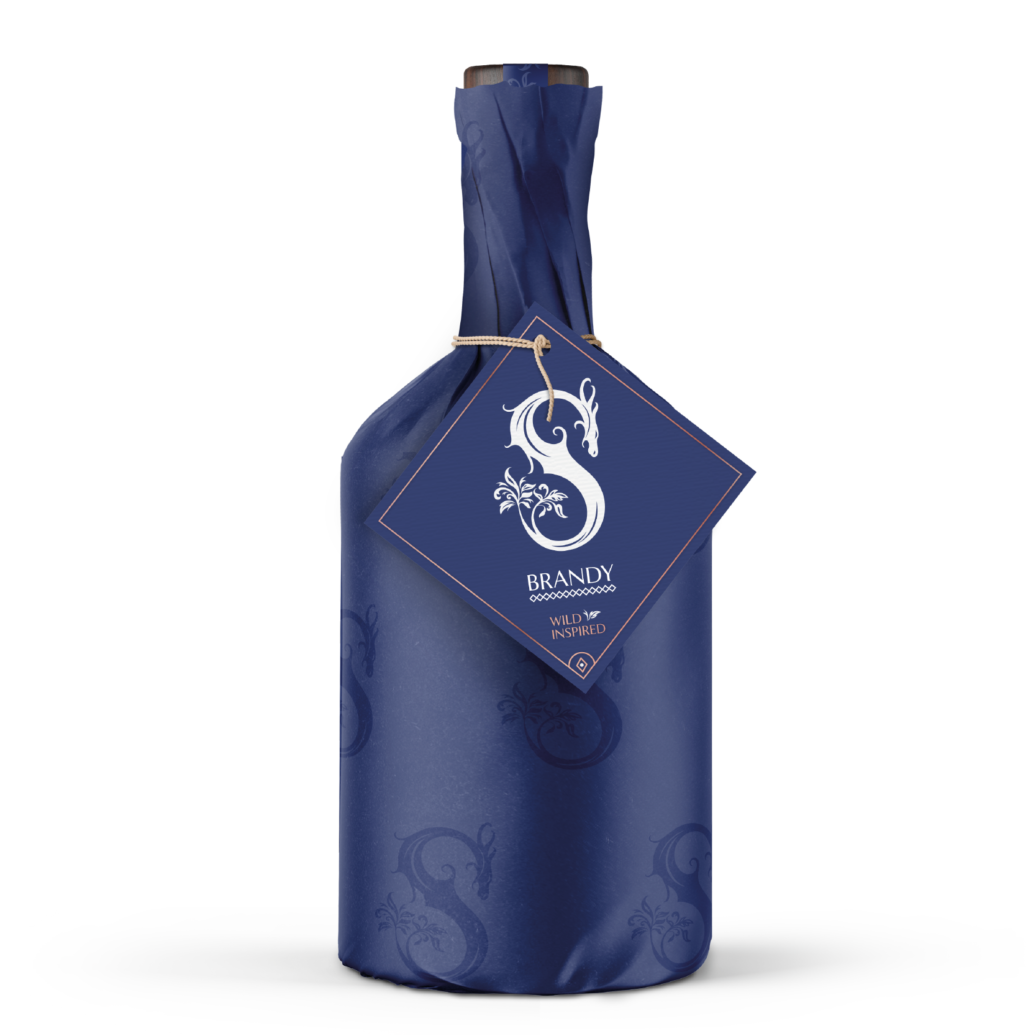 Slake Spirits Dragon Brandy blue bottle wrapped in Sussex Knucker print coming soon