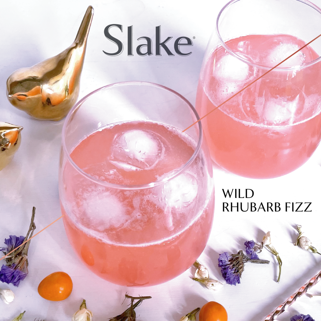 Gin & rhubarb syrup fizz served in a stemless wine glass